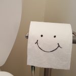 Toilet paper Roll With a Smiley Face Drawn On